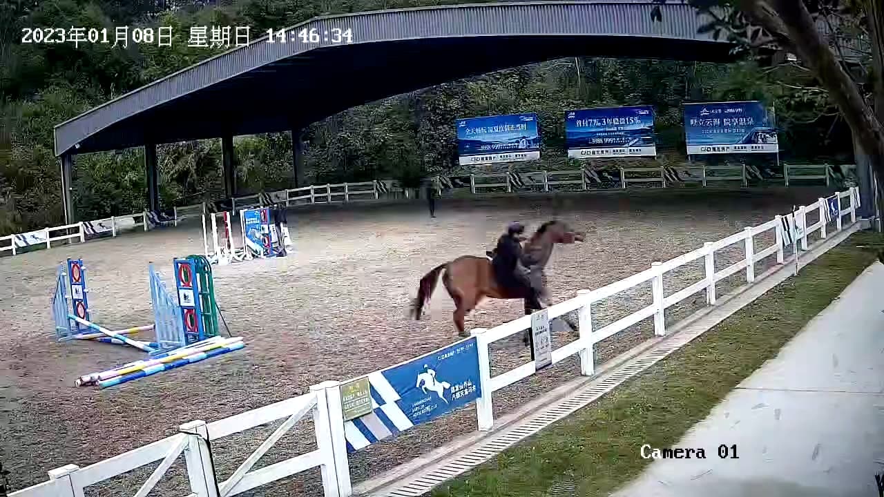 A still from the riding clip, before the fall.