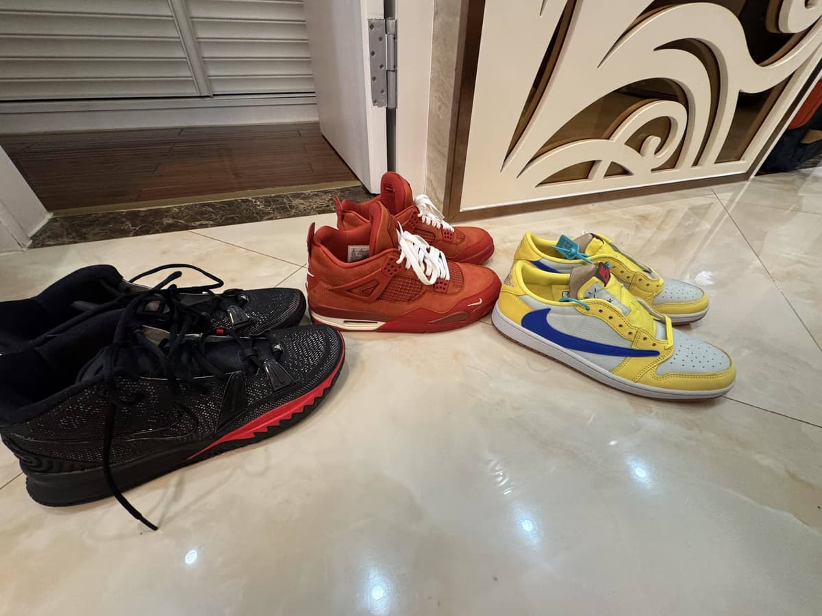 Three pairs from Yuzhe's sneaker collection: black and red, red, and yellow and blue.